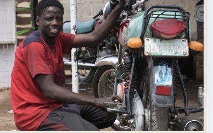 Mo repairing a motorcycle at his shop in Bauchi